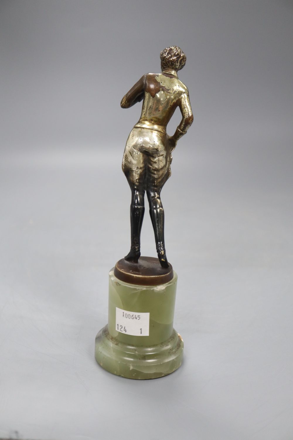 An Art Deco model of a horserider, on onyx base, height 19cm